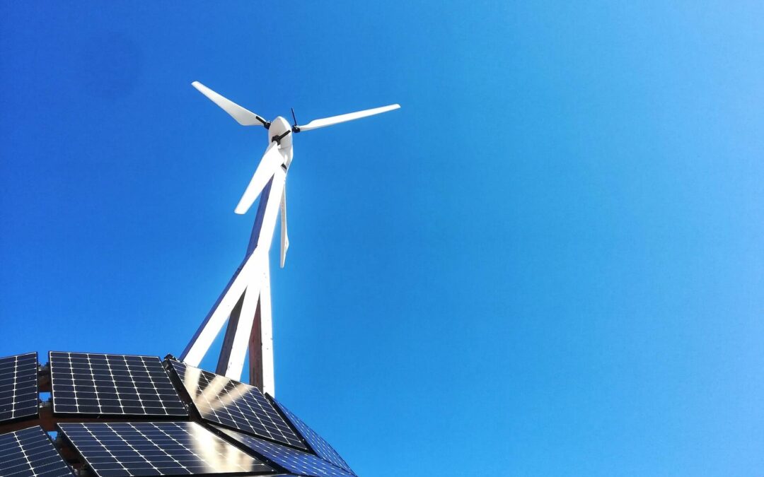 Solar panels and a wind turbine photo